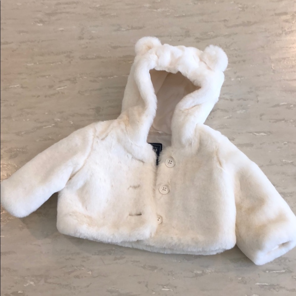 White faux fur coat